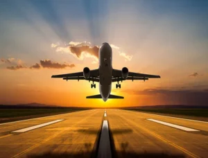 air freight cargo plane landing on air strip in sunset